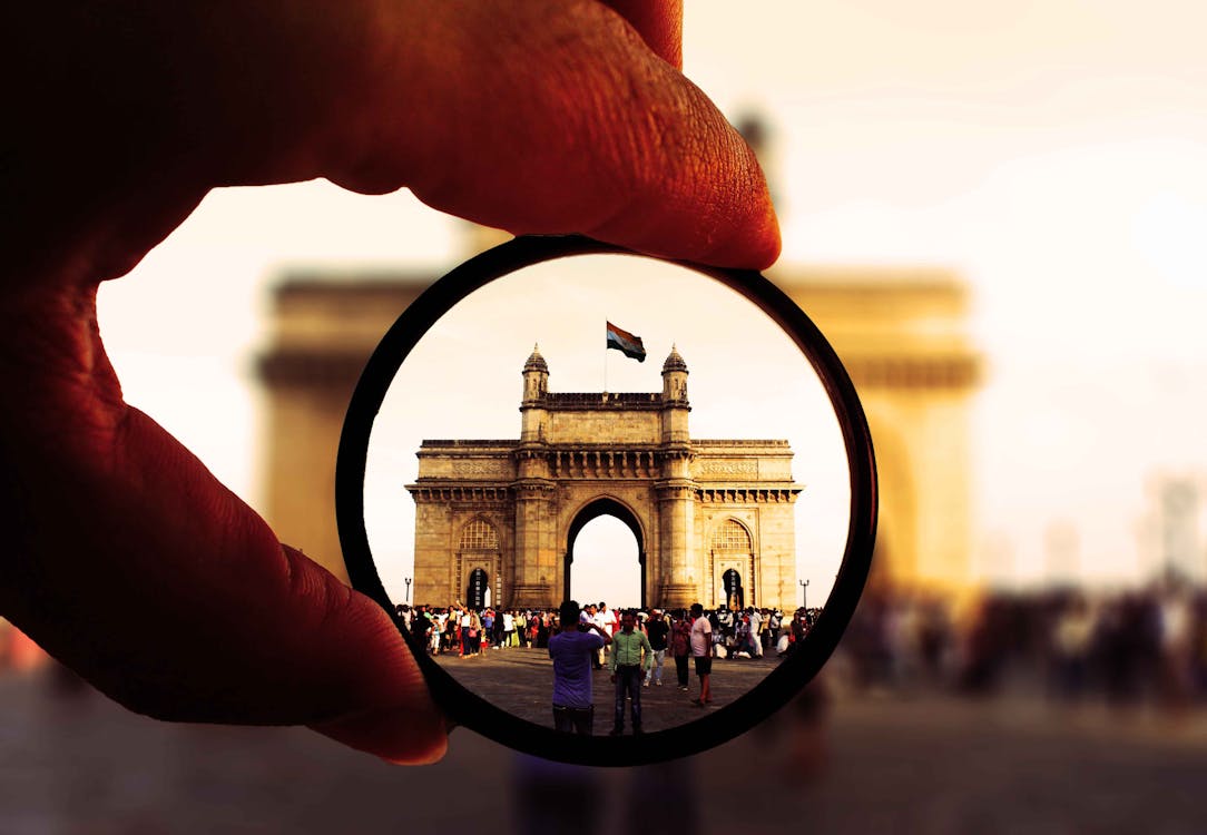 Free Person Holding Round Glasses in Shallow Photo Stock Photo