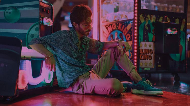 Bearded Man Sitting Near Slot Machines