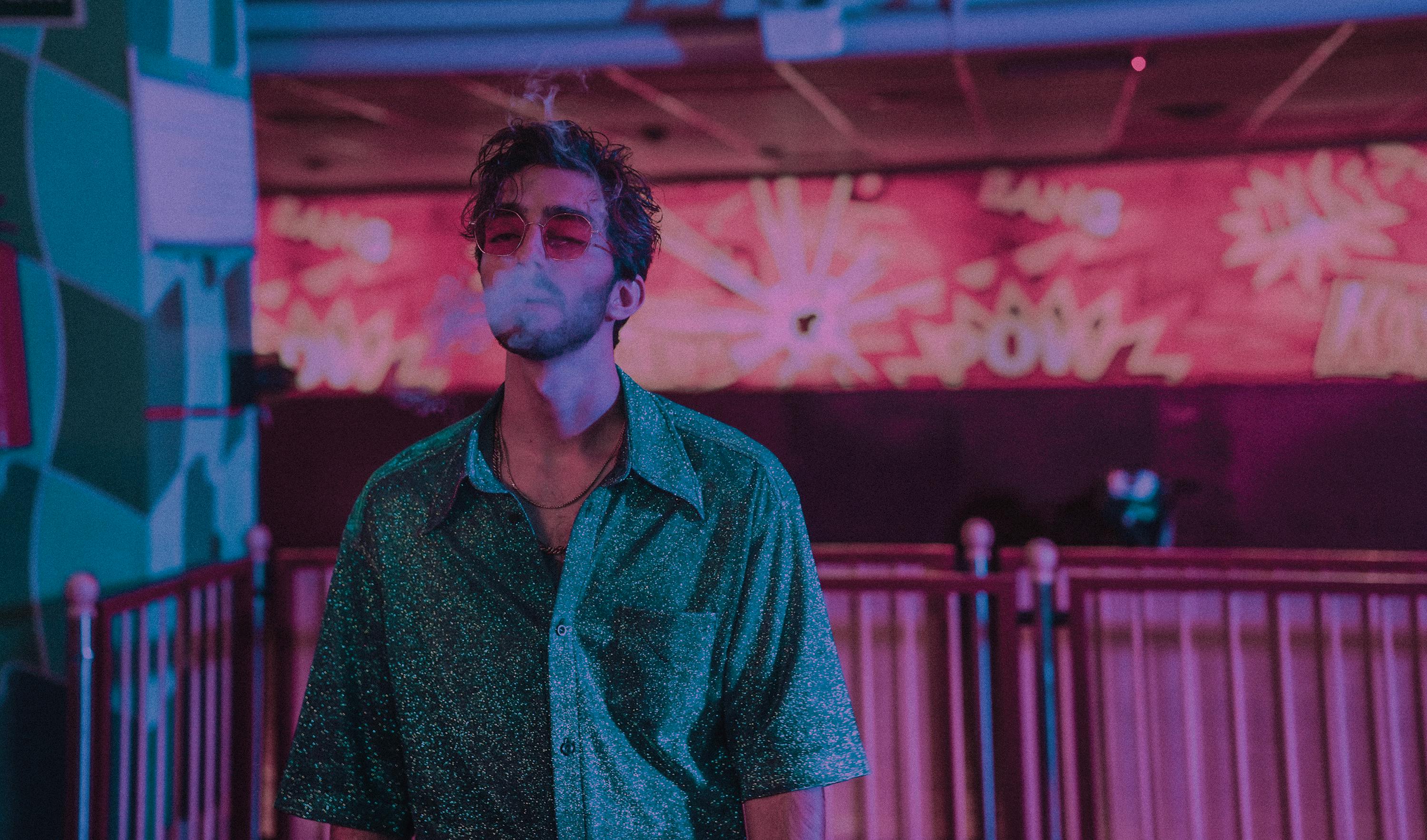 bearded man smoking in shopping center