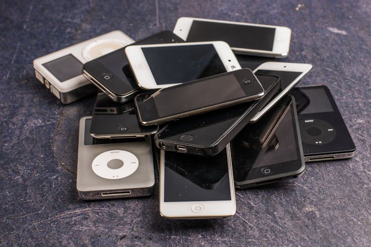 Pile Of Old Smartphones And Music Players