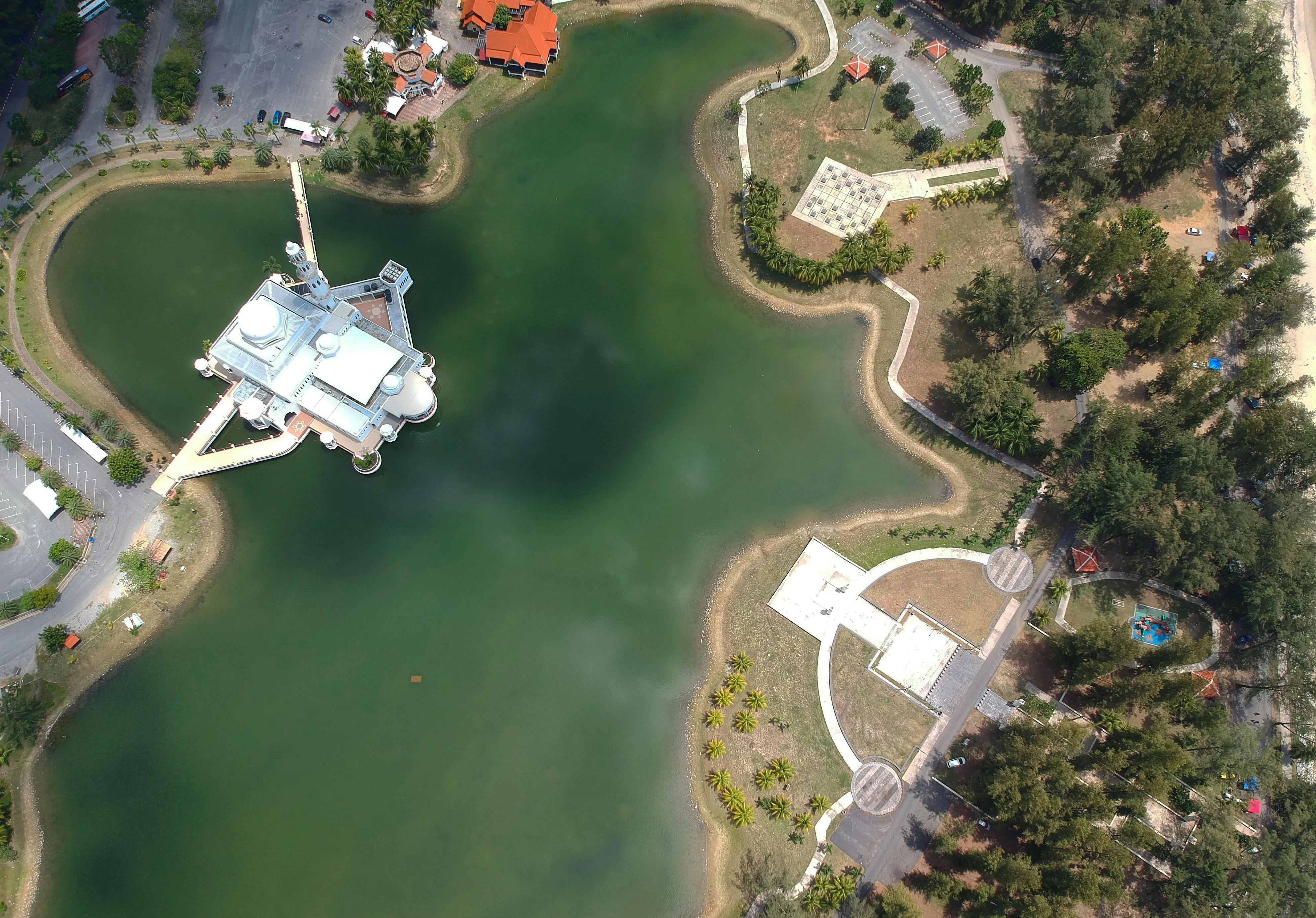 white building near body of water