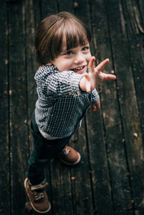 A Boy in Black and White Checkered Shirt