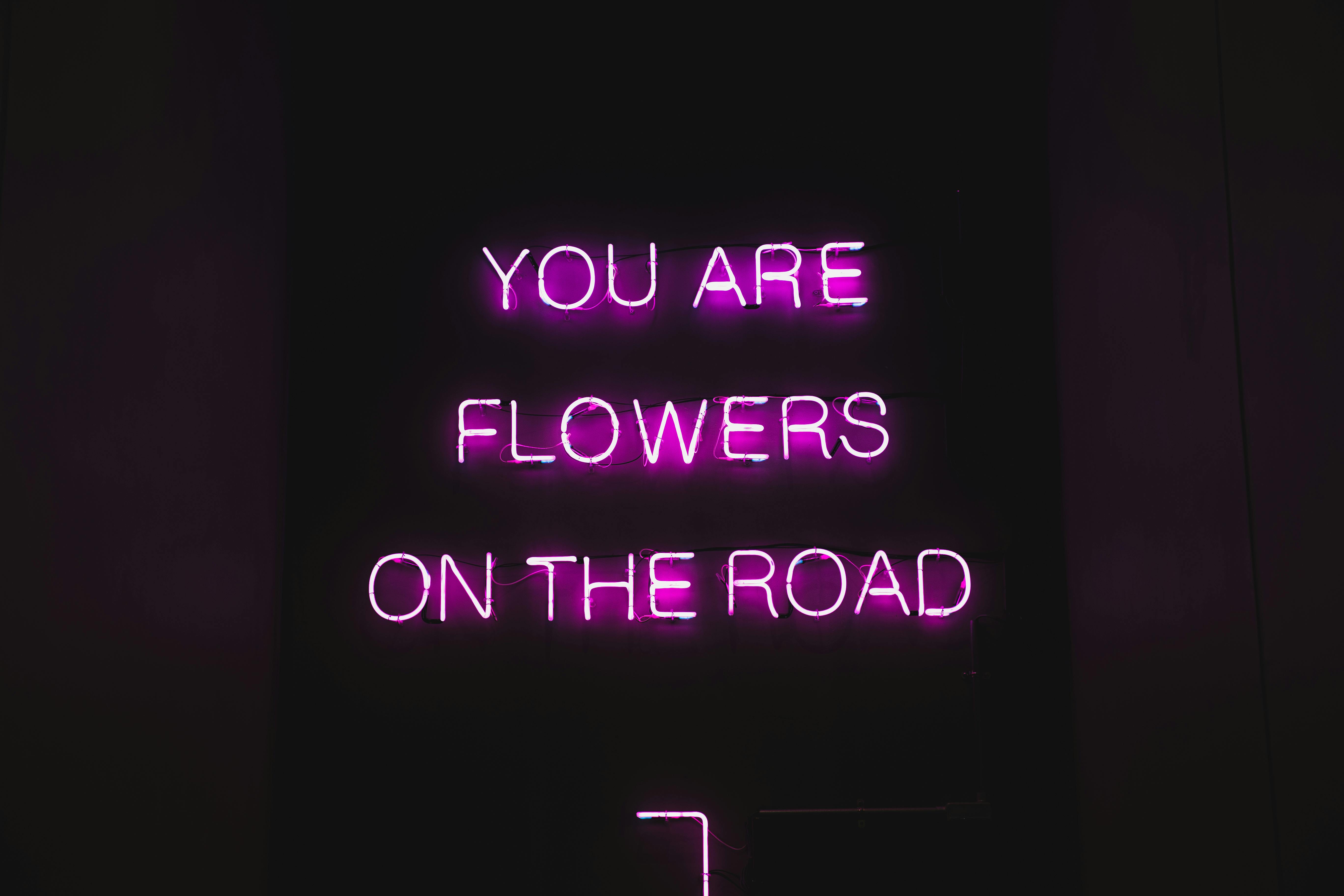 black billboard with pink text