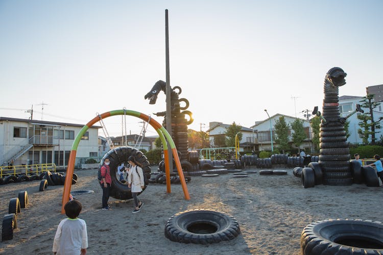 Suburb Yard With Figures Made Of Tyres