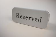 Small signage from restaurants and cafes