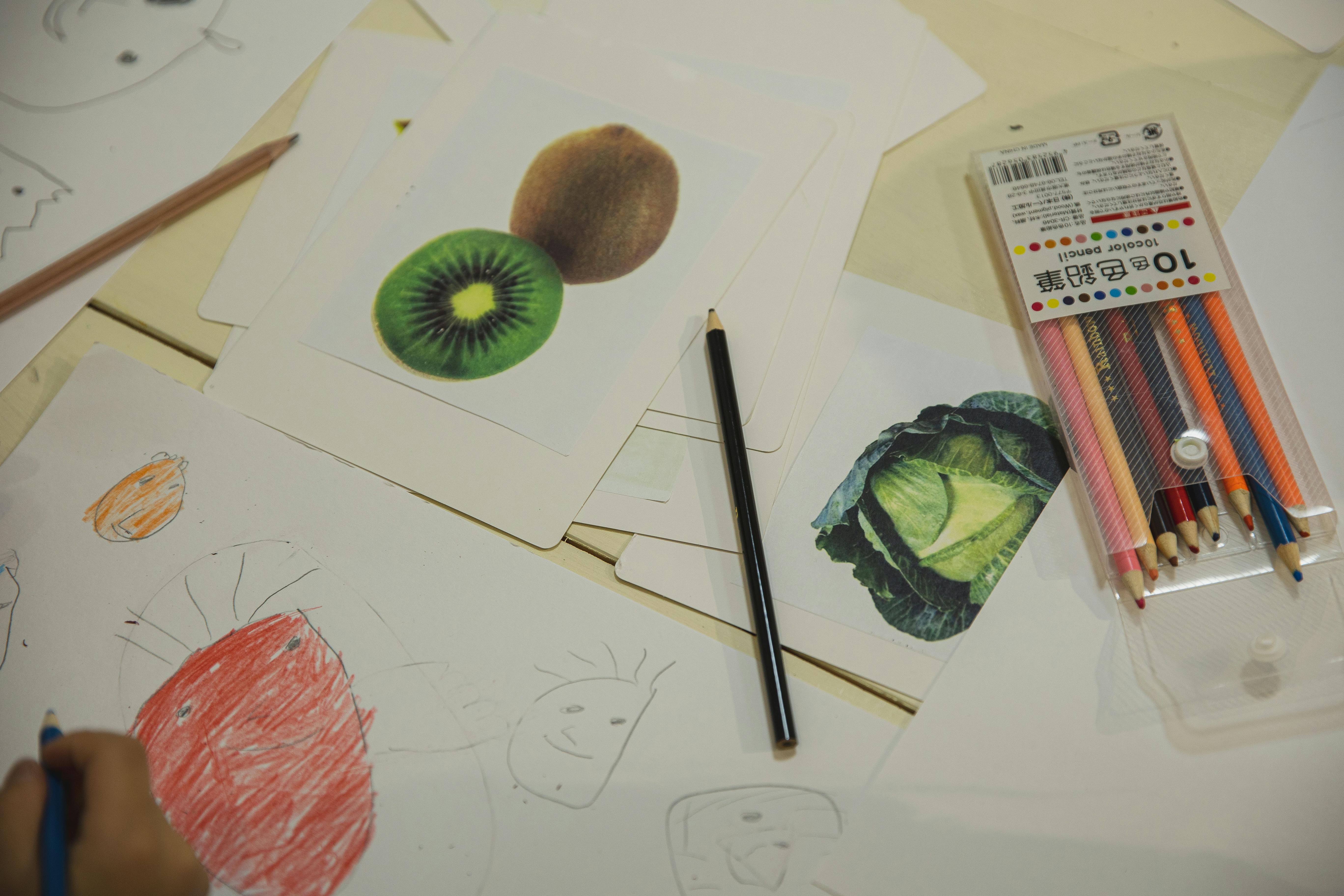 Black Pen Beside Green And Brown Round Fruit Free Stock Photo