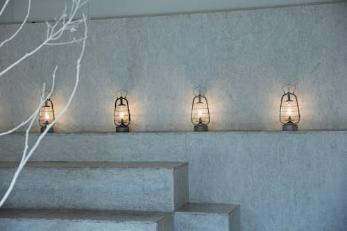 Glowing lamps in empty concrete room