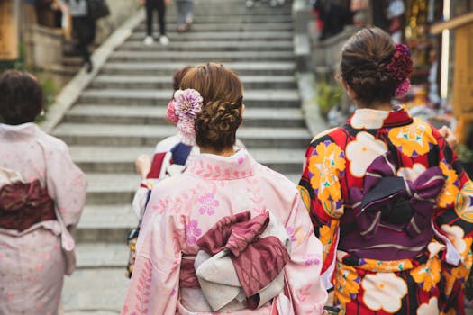 Japanese women wearing kimonos walking up steps in Kyoto, Japan.