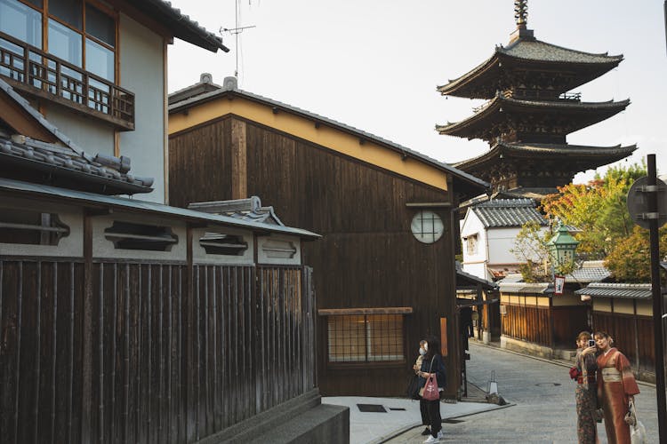 Japanese Women Taking Selfie On Authentic Street With Asian Pagoda