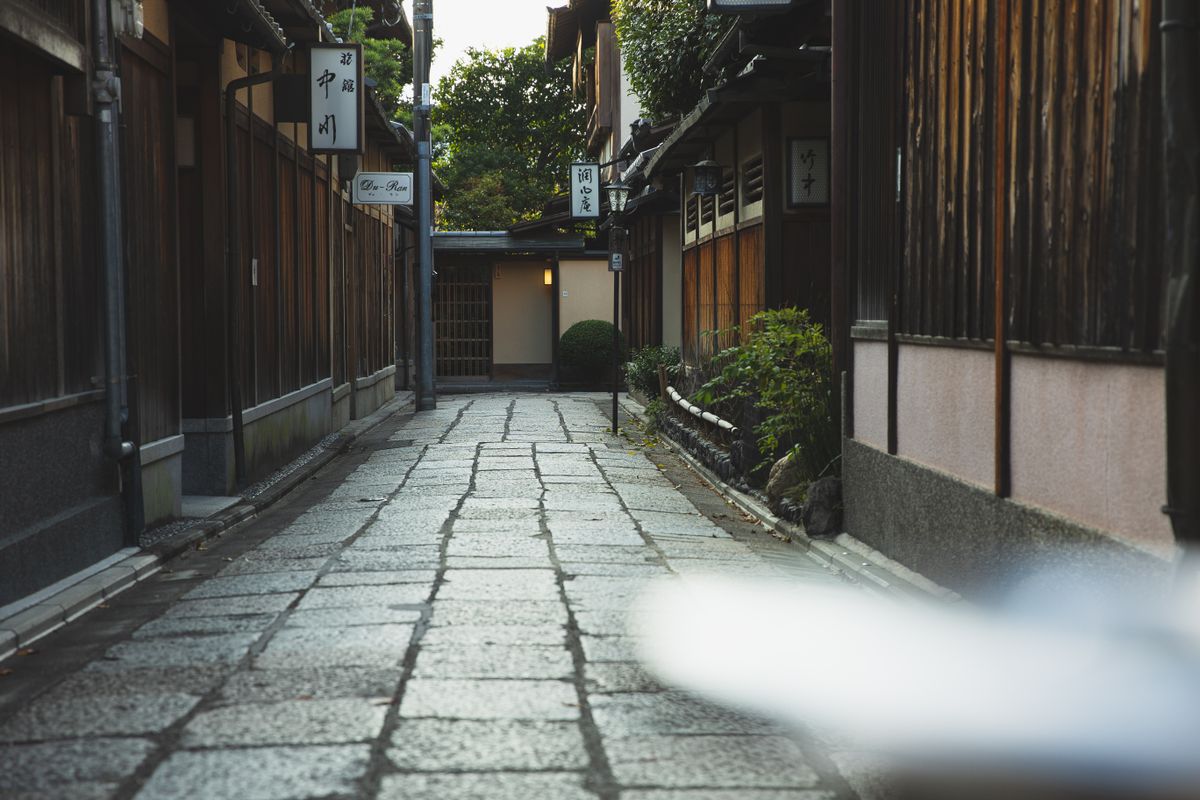Quiet Kyoto street with traditional machiya townhouses