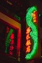 Bright neon lights with hieroglyphs on signboard