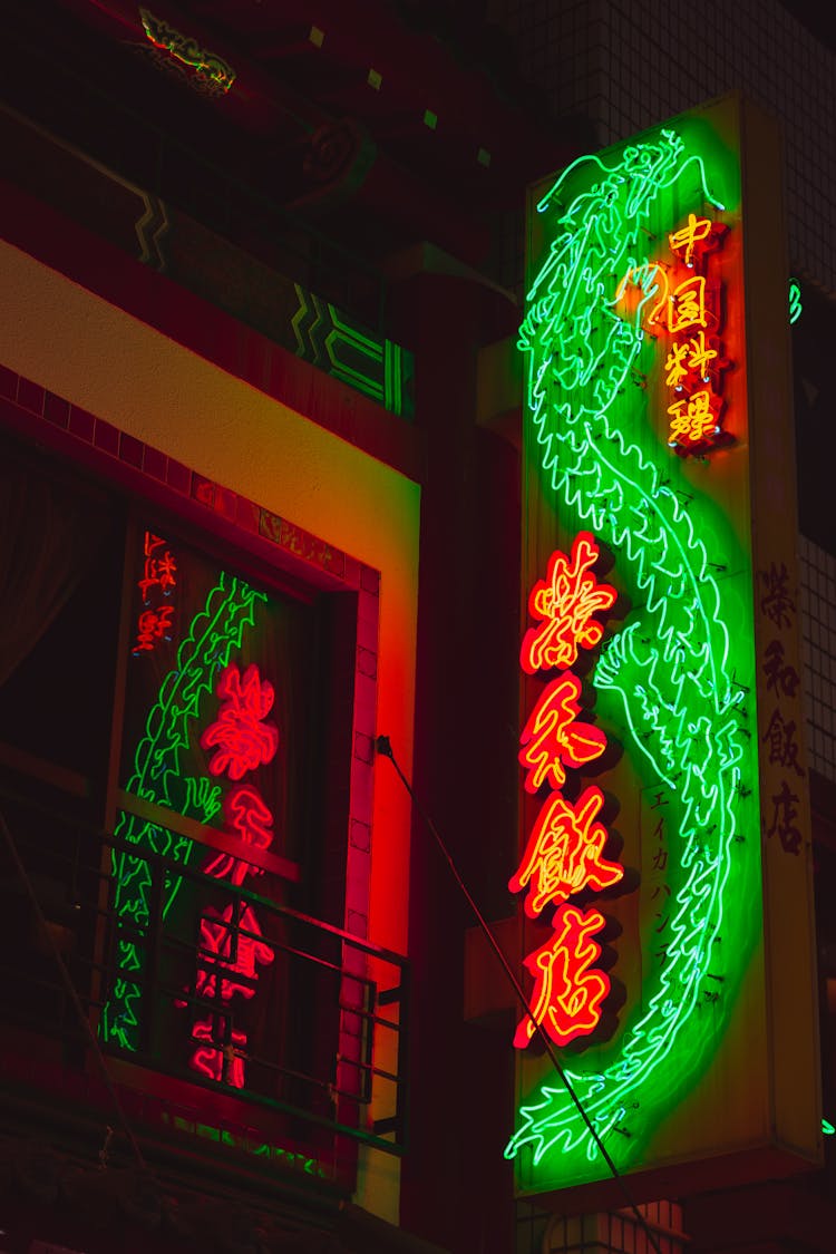 Bright Neon Lights With Hieroglyphs On Signboard