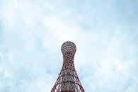 Tall observation sightseeing tower against clouds