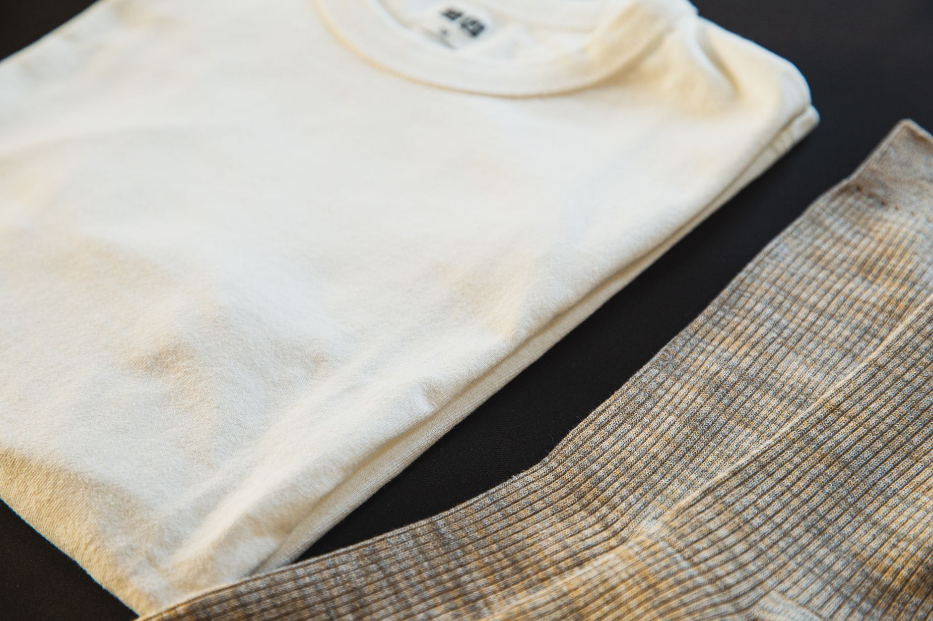 minimal clothing selection laid out flat