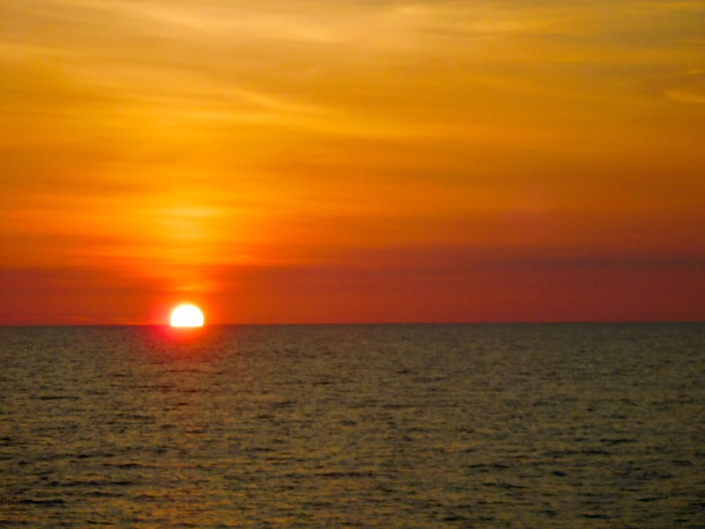 Безкоштовне стокове фото на тему «вечірнє небо, вечірнє сонце, Захід сонця»