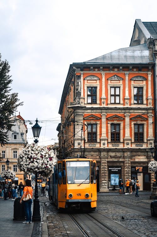 Yellow tram in classic city street