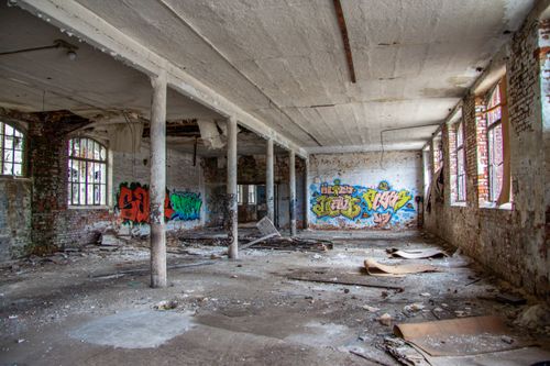 Free Explore the urban decay of a graffiti-filled, abandoned structure in Leipzig, Germany. Stock Photo