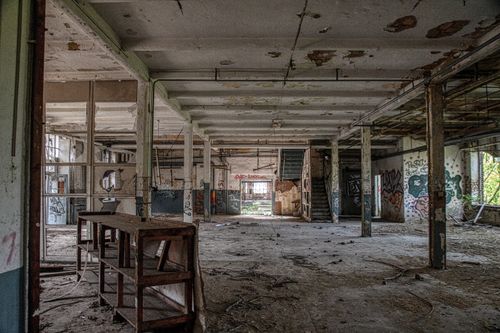 Free Explore the interior of an abandoned industrial building in Leipzig, Germany, covered in graffiti. Stock Photo