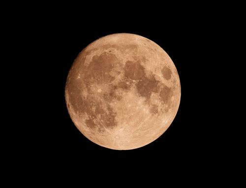 Free A stunning full moon captured against a pitch-black night sky. Stock Photo
