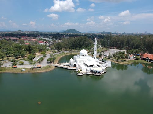 White Painted Building on Body of Water