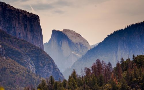 Free Scenic view of Half Dome and surrounding landscape in Yosemite Valley, capturing the essence of nature's beauty. Stock Photo