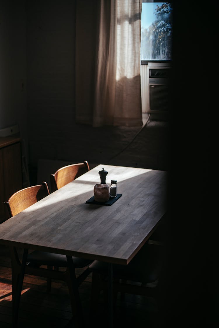 Interior Of Room With Table Under Sunlight