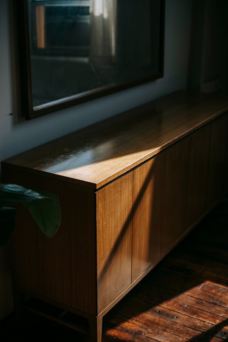 Vintage Cabinet At Wall With Mirror