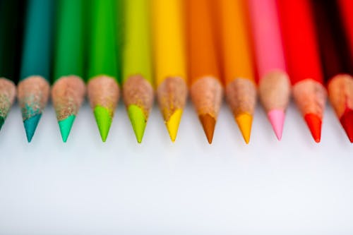 Multicolored pencils on white table