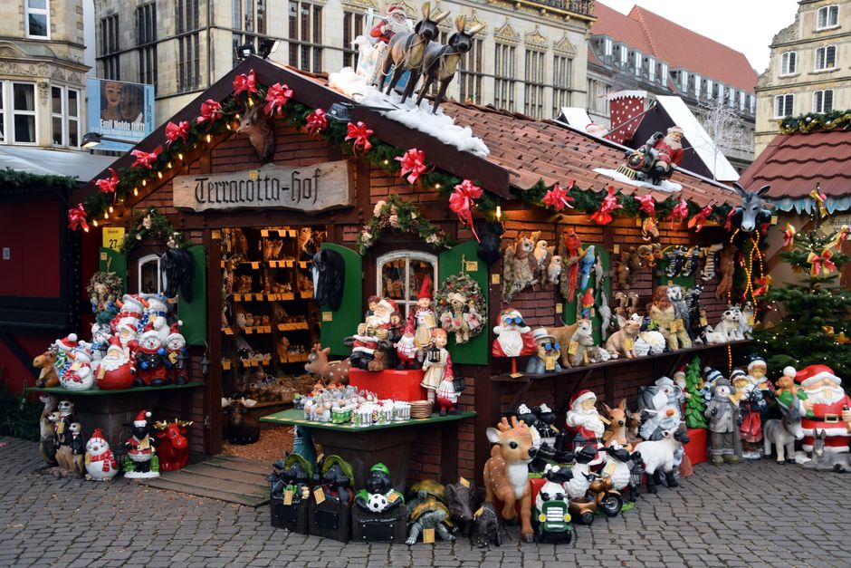 Festive Christmas market stall with colorful decorations in Bremen, Germany.