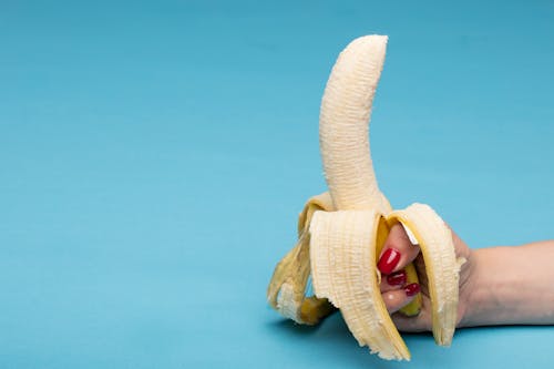 A Person Holding a Banana