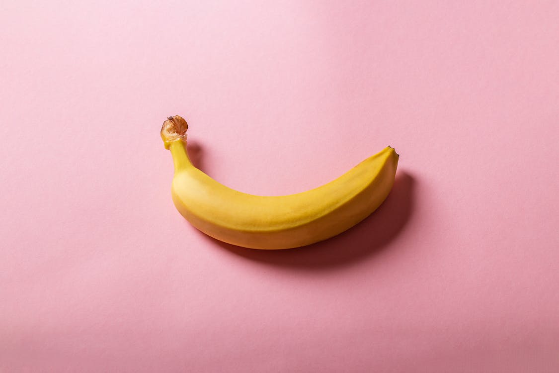 Free Yellow Banana on White Table Stock Photo