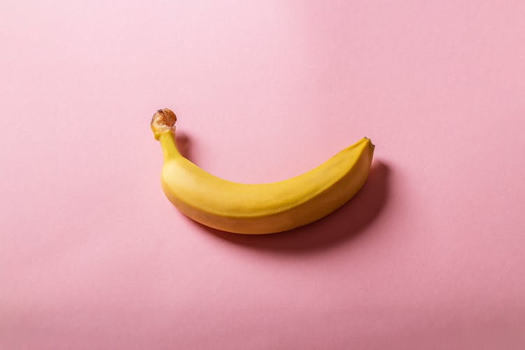 Banana On Pink Surface