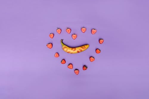 Yellow Banana on Purple Background