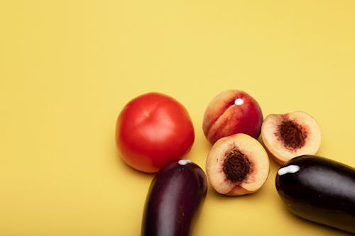 Sliced Fruits on Yellow Background