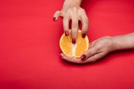 A Person Holding an Orange Fruit