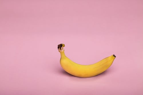 Free Yellow Banana on Pink Background Stock Photo