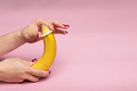 A Person Holding Yellow Banana Fruit