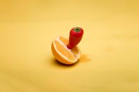 Yellow and Red Fruit on Yellow Surface