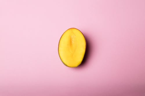 Sliced Mango on Pink Surface
