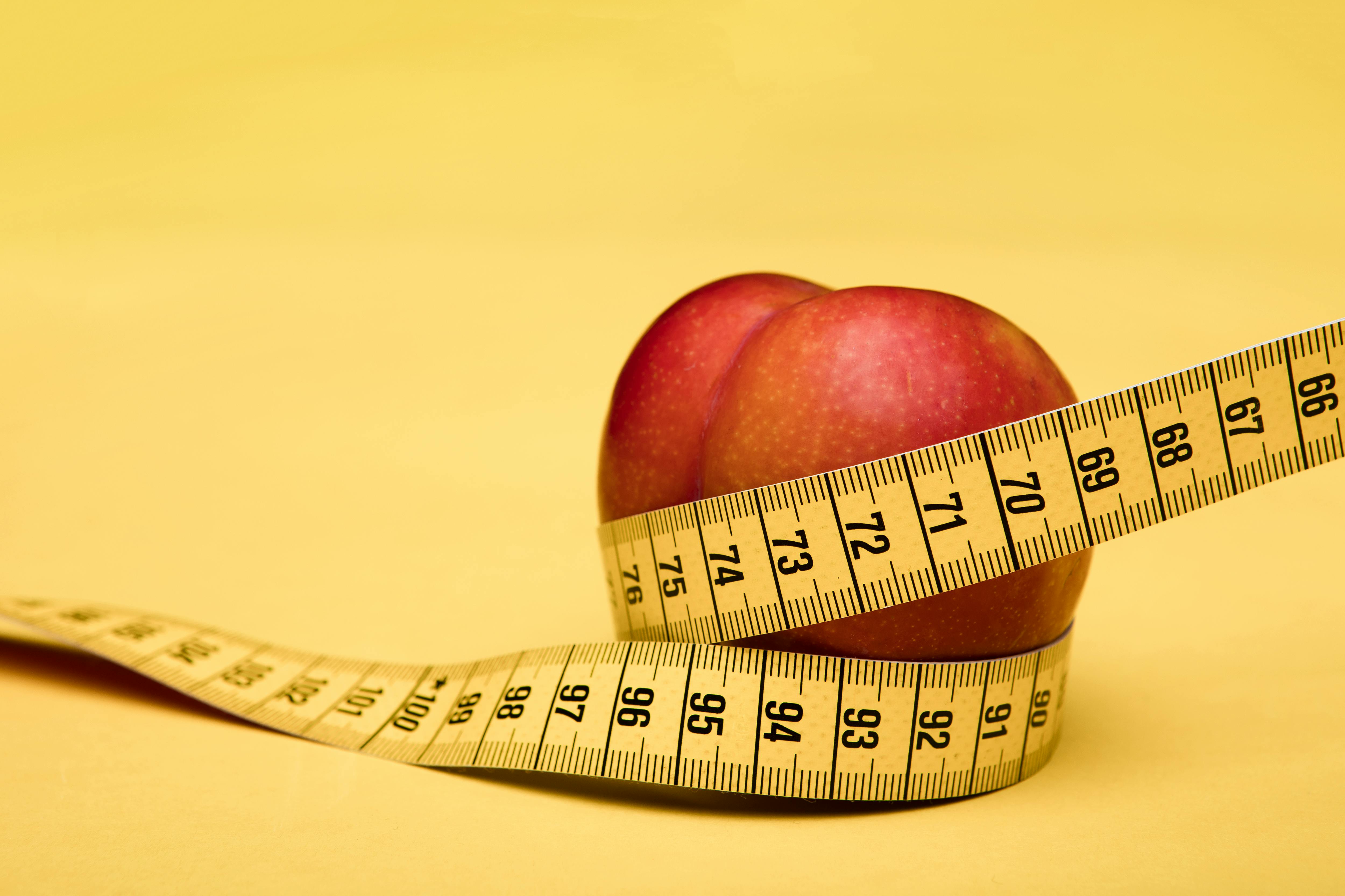 Measuring Tape Wrapped Around A Apple Weight Loss Photo Stock Photo,  Picture and Royalty Free Image. Image 32340153.