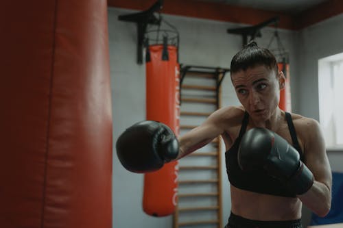 Free Woman Workout with a Punching Bag  Stock Photo