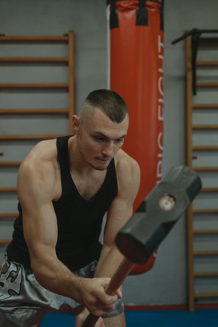 Man Using A Sledgehammer