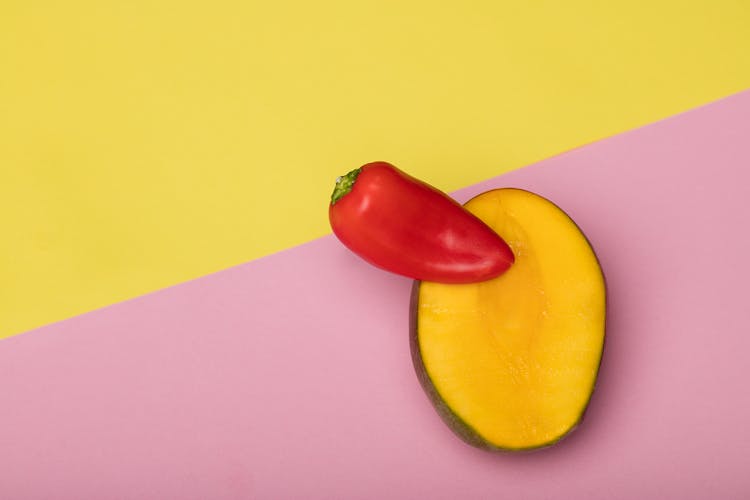 A Red Pepper In A Sliced Mango