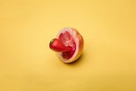 Sliced Apple Fruit on Yellow Surface