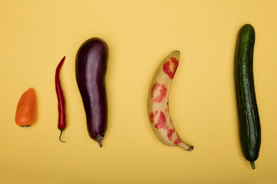 Vibrant assortment of fruits and vegetables on a yellow backdrop.