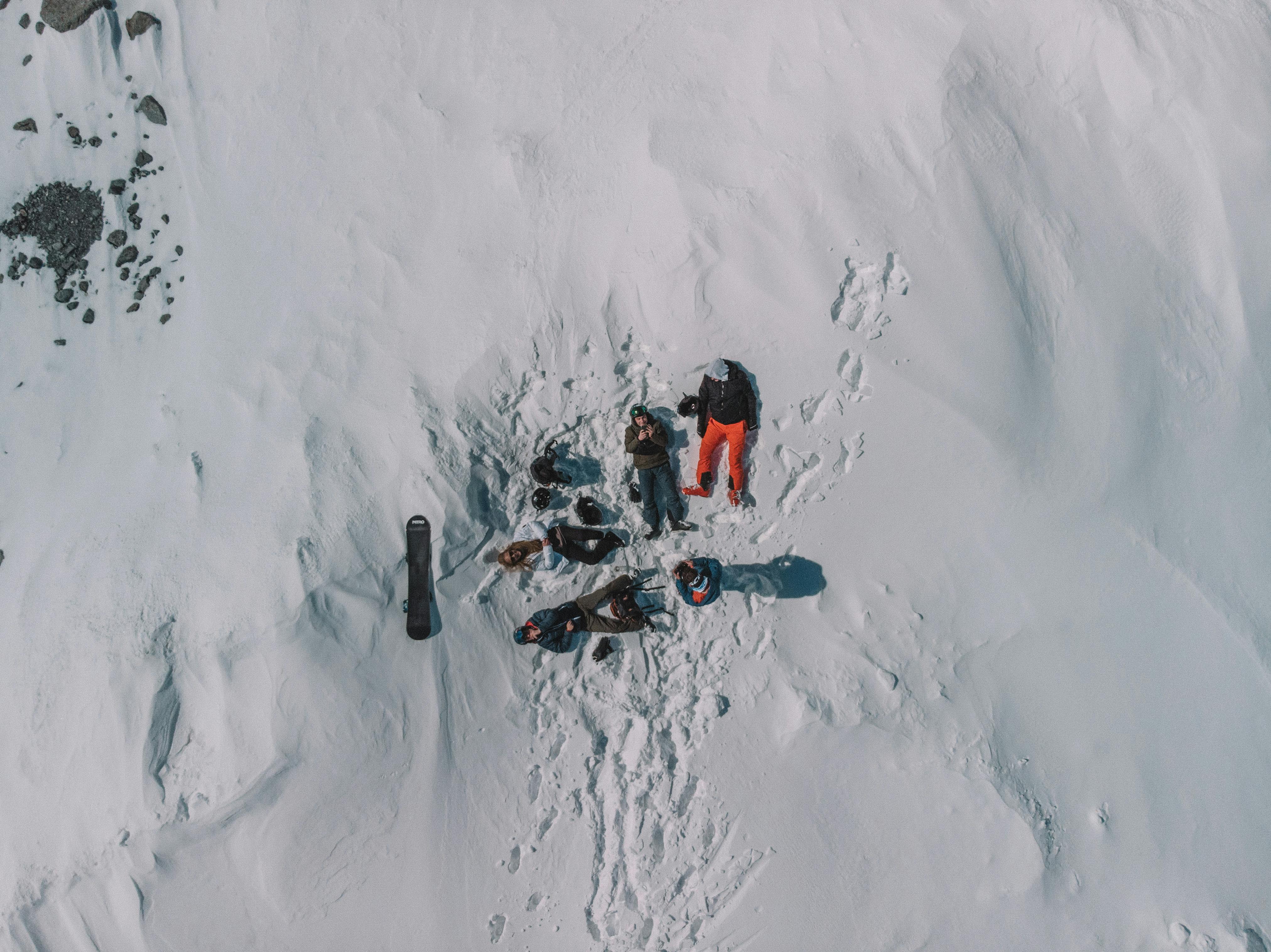 Prescription Goggle Inserts - Drone shot capturing a group relaxing on a snowy slope in Les Belleville, France.