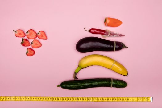 Measuring Vegetables and Fruits on Pink Surface