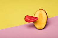 Sliced Green Fruit on Pink Table