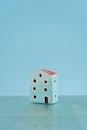 Model of a House against a Blue Background
