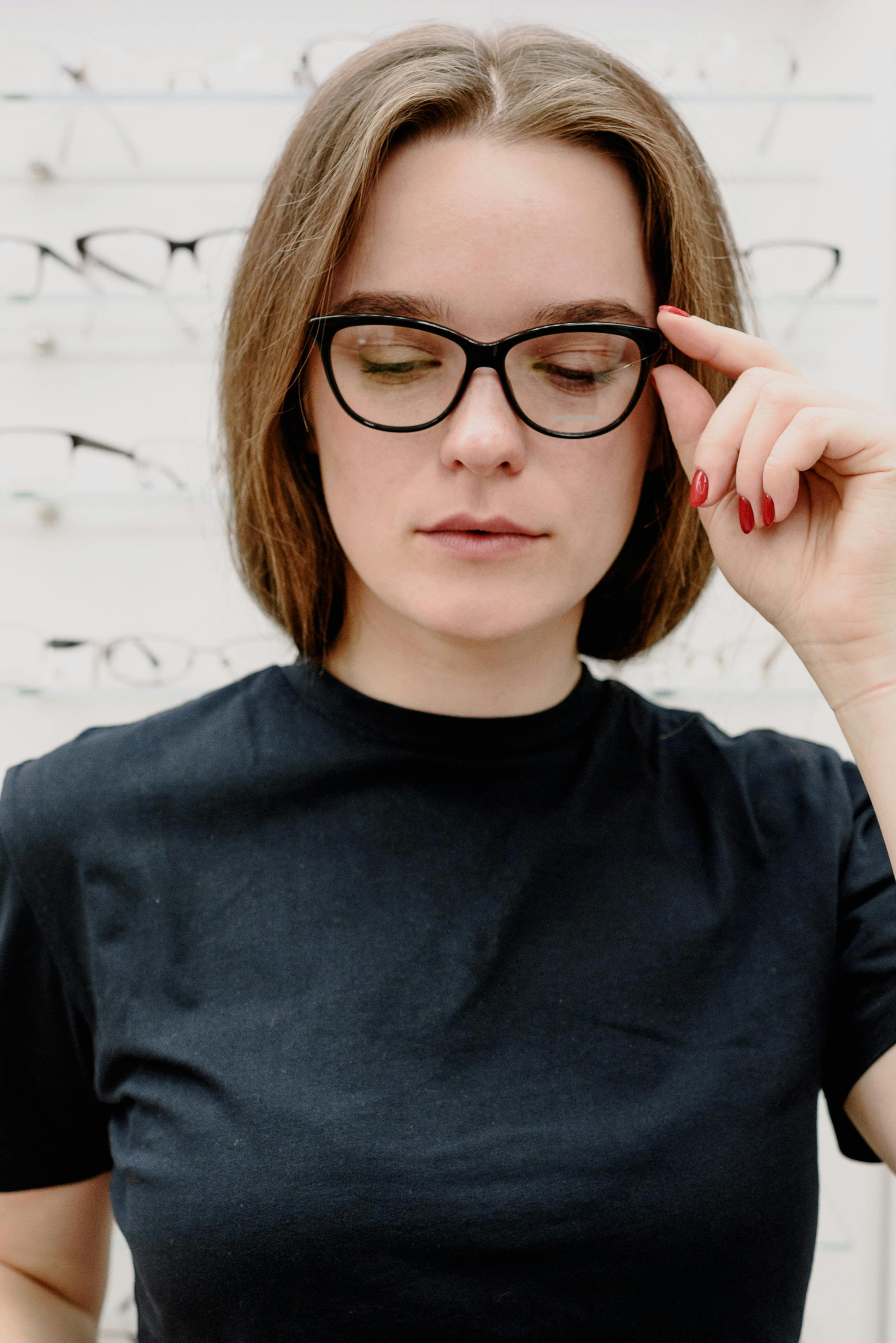 young woman in eyeglasses in salon